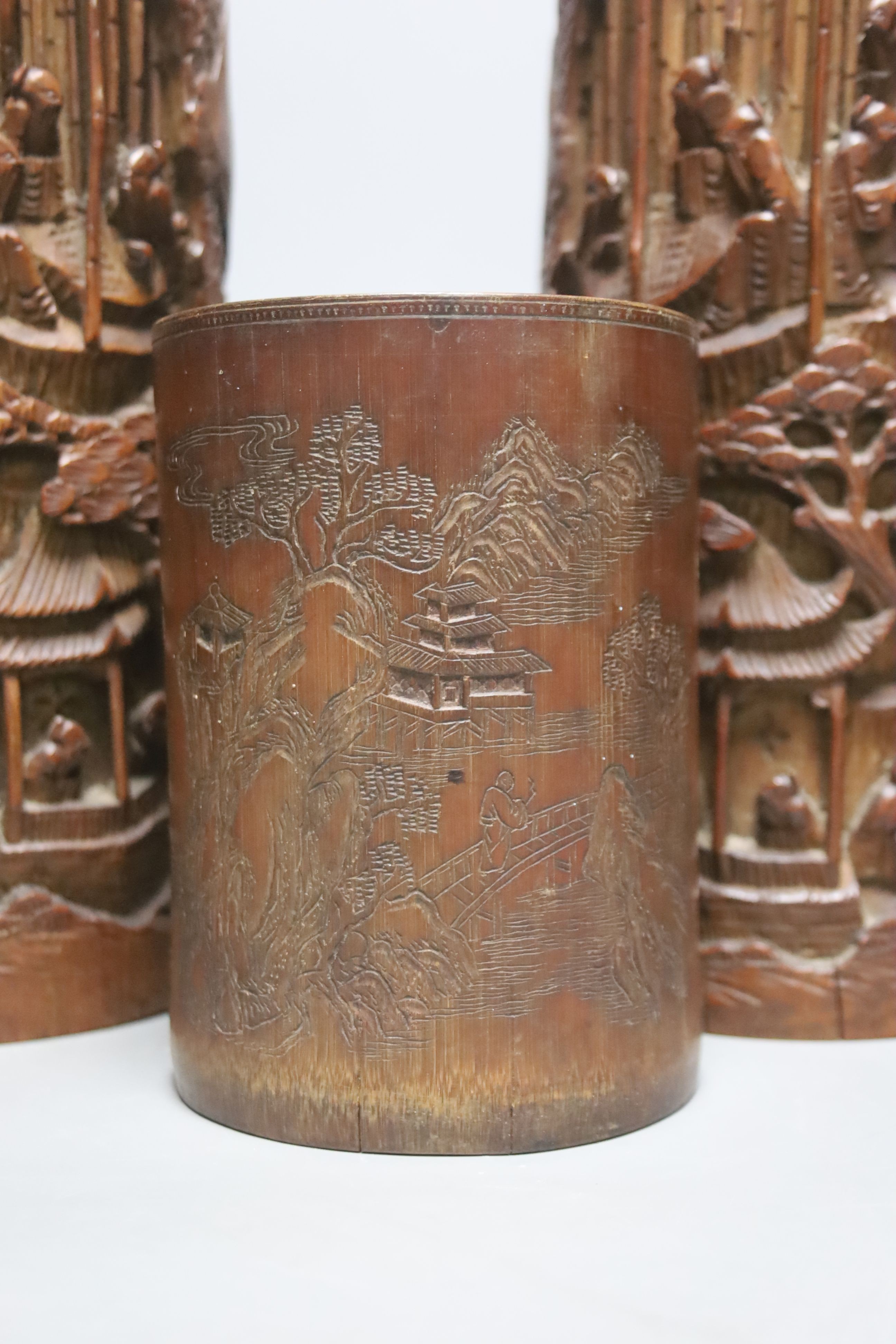 Four Chinese bamboo brushpots and a caddy, tallest brush pot 29 cms high.